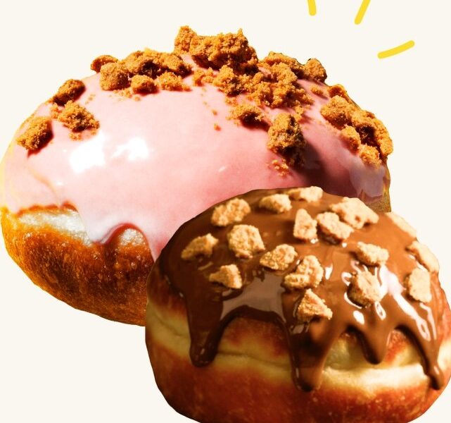 A pink-glazed doughnut and a chocolate-glazed doughnut from Sesame, both topped with crumble